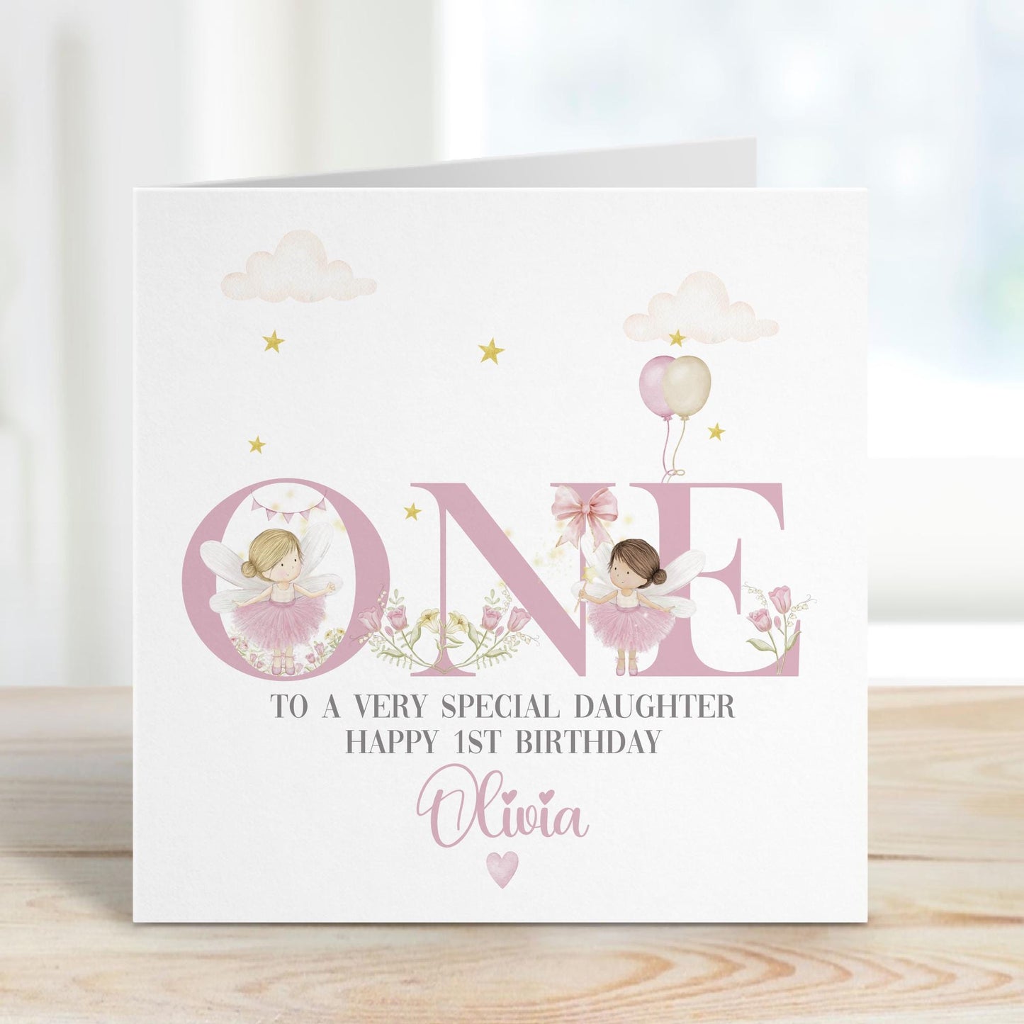 White Luxury, lightly textured 1st birthday fairy cards featuring the word ONE in pink text with pretty hand drawn fairies & wild flowers & balloons perfect for any fairies 1st birthday. Includes the wording, to a very special daughter/granddaughter, Sister, Niece, any relation. Cards measure 6 x 6 inches square.