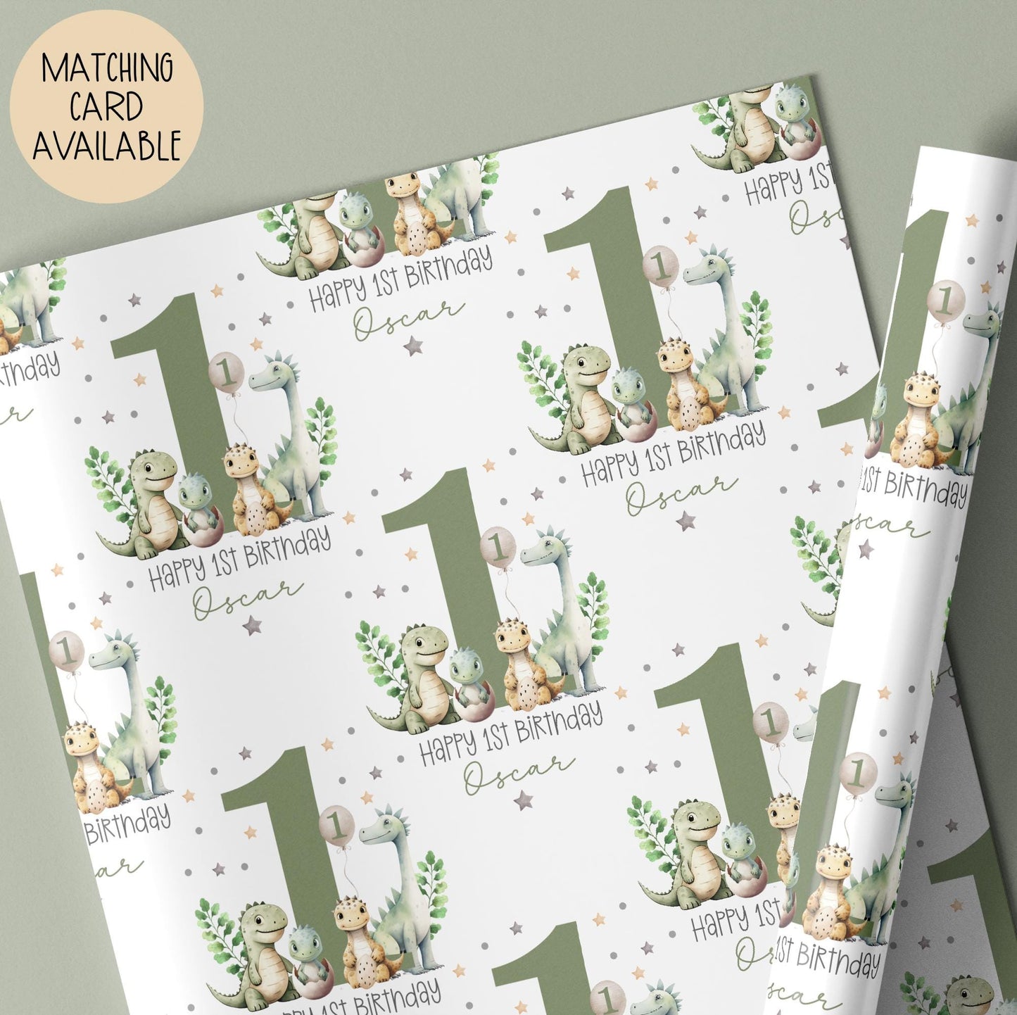 Personalised gift wrap for a 1st birthday featuring a large sage green number '1' surrounded by cute dinosaurs & stars. The design includes the text ' Happy 1st Birthday' Personalised with a name.