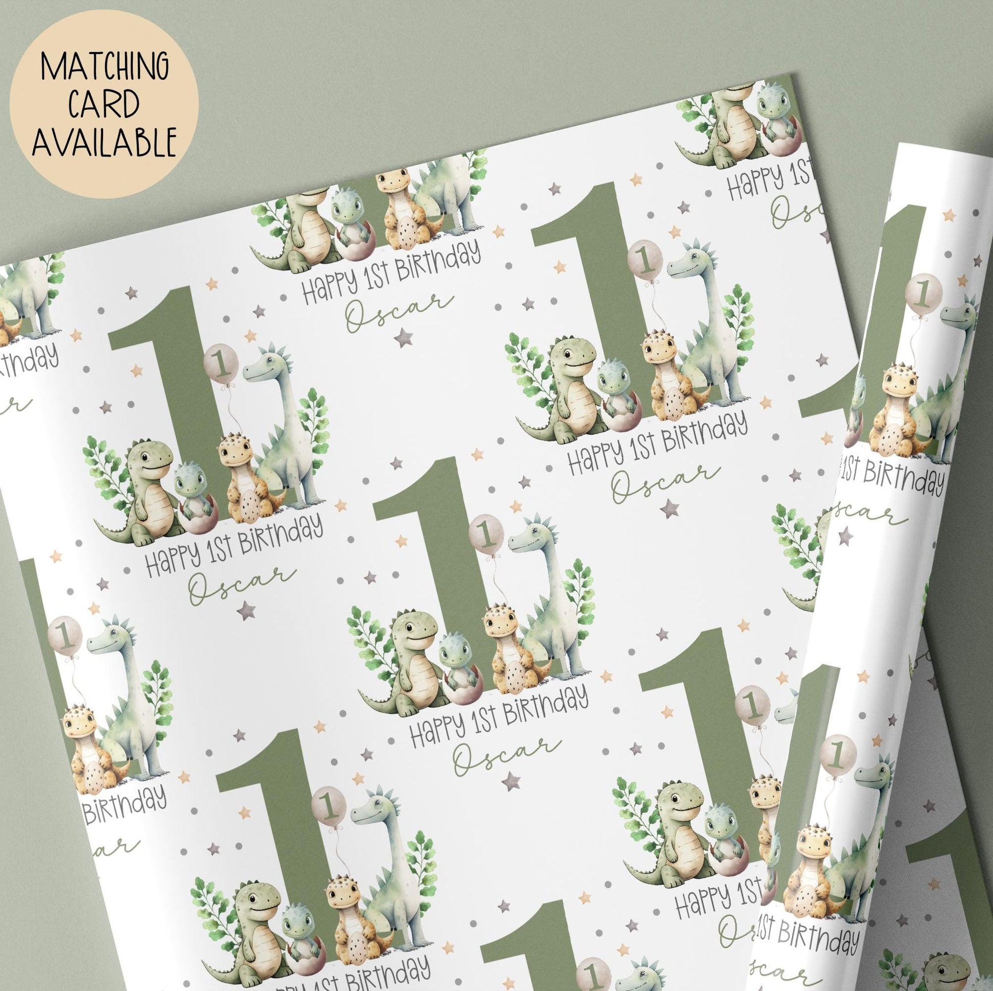 Personalised gift wrap for a 1st birthday featuring a large sage green number '1' surrounded by cute dinosaurs & stars. The design includes the text ' Happy 1st Birthday' Personalised with a name.