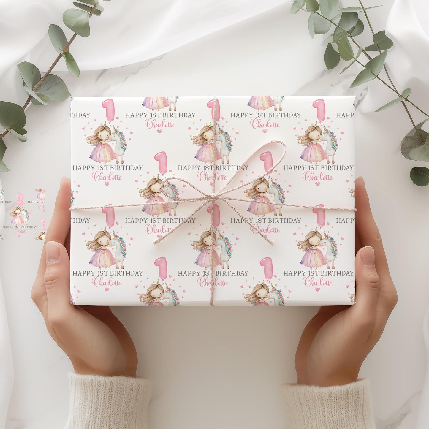 White luxury 1st birthday personalised wrapping paper featuring a gorgeous pastel coloured unicorn & a princess with a number 1 pink balloon and the wording, Happy 1st Birthday personalised with childs name.
