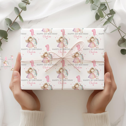 White luxury 1st birthday personalised wrapping paper featuring a gorgeous pastel coloured unicorn & a princess with a number 1 pink balloon and the wording, Happy 1st Birthday personalised with childs name.