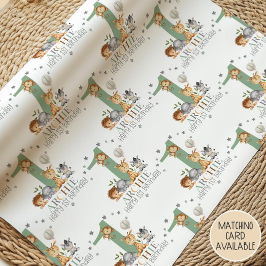 Personalised gift wrap for a 1st birthday featuring a large sage green number '1' surrounded by cute safari animals & grey stars. The design includes the text ' Happy 1st Birthday' Personalised with a name in multi-coloured text.