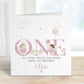White Luxury, lightly textured 1st birthday fairy cards featuring the word ONE in pink text with pretty hand drawn fairies & wild flowers & balloons perfect for any fairies 1st birthday. Includes the wording, to a very special daughter/granddaughter, Sister, Niece, any relation. Cards measure 6 x 6 inches square.