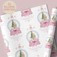 Personalised Christmas wrapping paper featuring a ballerina holding a teddy inside a pink snow globe with a Christmas tree, rocking horse, and presents. Text reads “Merry Christmas to our beautiful granddaughter/Daughter/Any relations&quot; Personalised with a name.