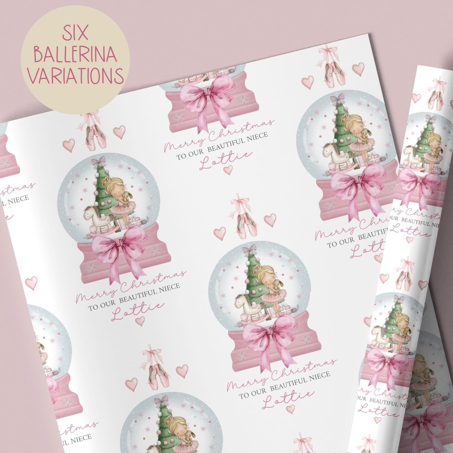 Personalised Christmas wrapping paper featuring a ballerina holding a teddy inside a pink snow globe with a Christmas tree, rocking horse, and presents. Text reads “Merry Christmas to our beautiful granddaughter/Daughter/Any relations&quot; Personalised with a name.