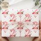 Personalised gift wrap for a 2nd birthday featuring a large red watercolor number &#39;2&#39; adorned with strawberries, gingham bows, and flowers. The design includes the text &#39;To a berry special granddaughterDaughter/any relation Happy 1st Birthday&#39; Personalised with a name.