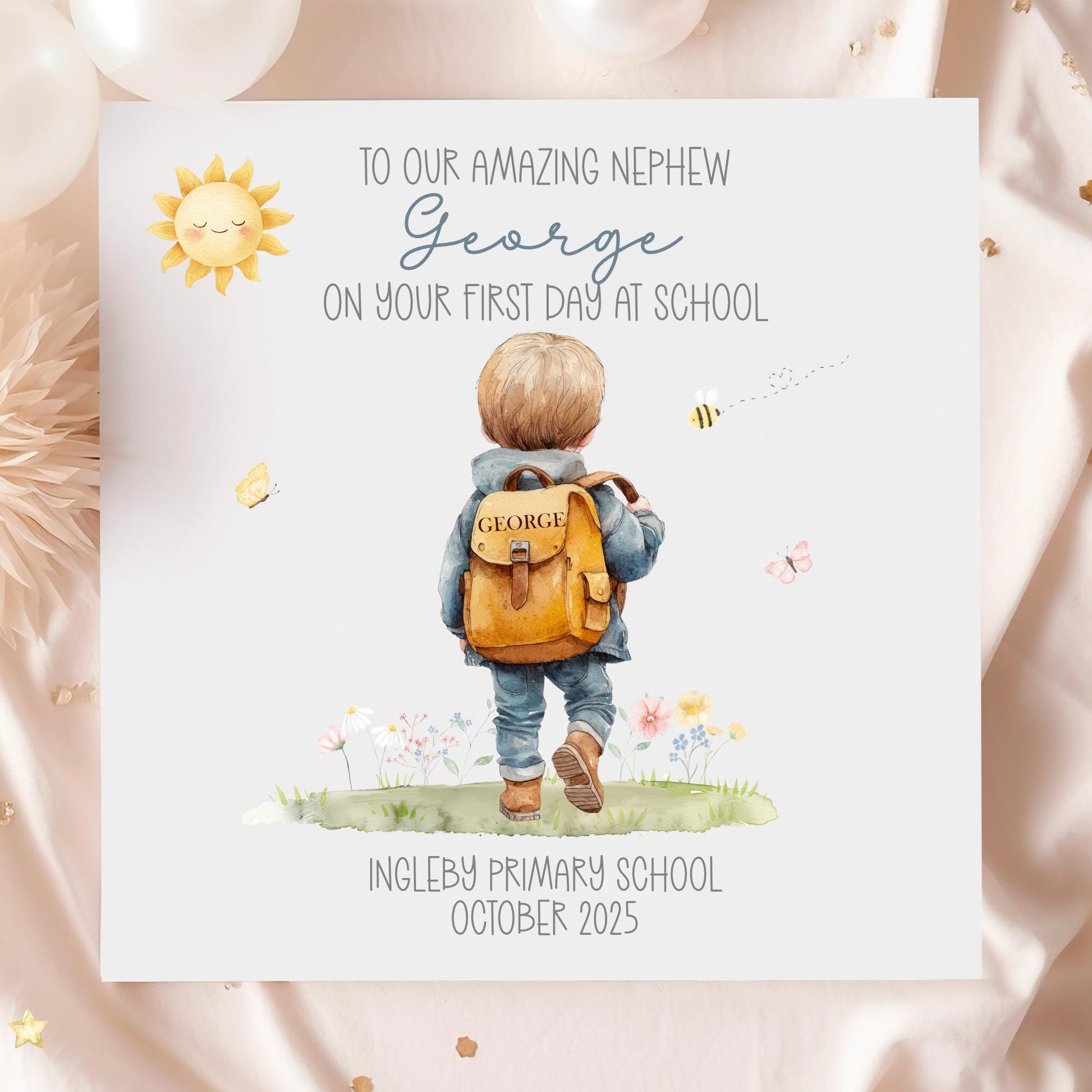 Personalised first day of school card featuring a cute illustration of a boy with a backpack, butterflies, flowers, and a smiling sun. Customisable with child’s name, school, and date. A unique keepsake card for boys or girls starting school, perfect gift from parents or grandparents.
