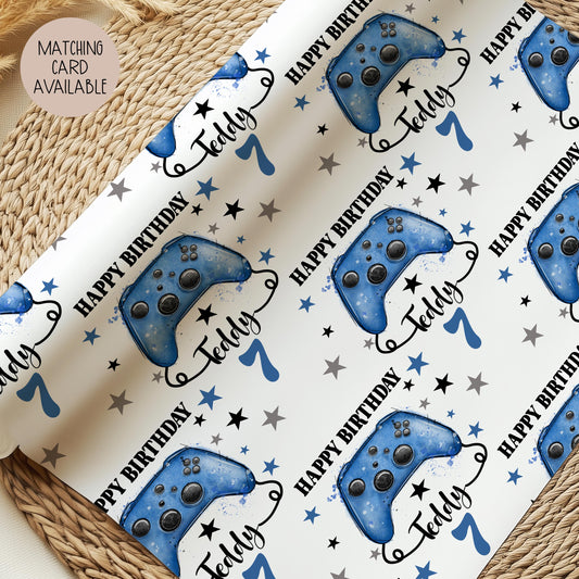 Personalised Luxury Gamer birthday gift wrap featuring a blue game controller. The wording Happy Birthday, Personalised with a name.
