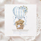Personalised first Mother’s Day card for new mum, featuring two teddy bears in a wicker basket inside a blue hot air balloon with soft florals and hearts and the wording 'Happy 1st mothers day as my amazing mummy' Personalised with a name.