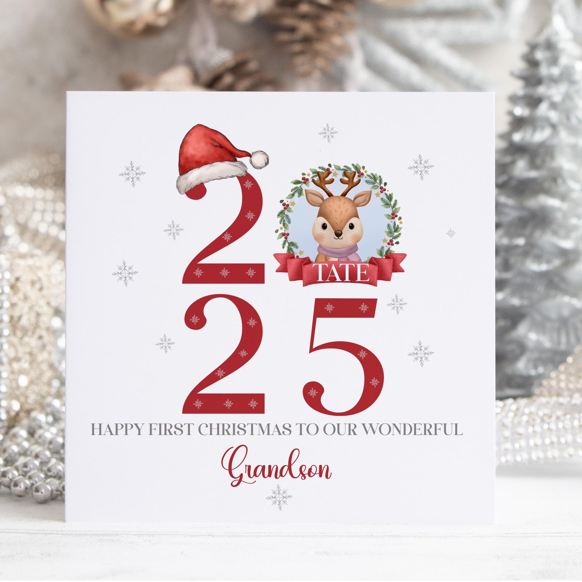Personalised baby’s first Christmas card featuring a bright festive red design with watercolour illustrations and the year 2025. Perfect for a baby boy or girl’s first Christmas.