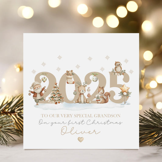 Personalised baby’s first Christmas card featuring soft neutral watercolour illustrations with the year 2025. A unisex design perfect for a baby boy or girl, printed on luxury linen card.