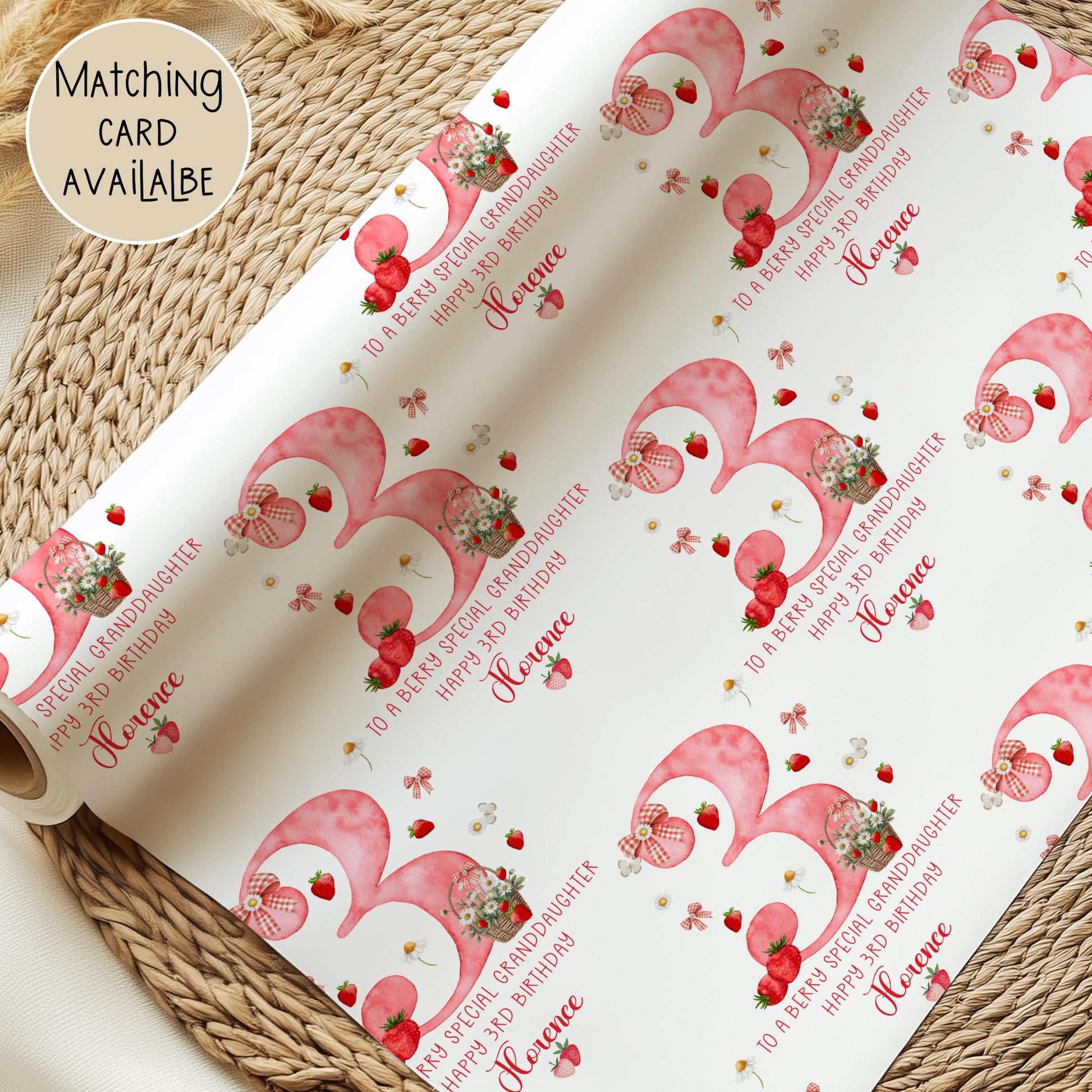 Personalised gift wrap for a 3rd birthday featuring a large red watercolor number &#39;1&#39; adorned with strawberries, gingham bows, and flowers. The design includes the text &#39;To a berry special granddaughterDaughter/any relation Happy 3rd Birthday&#39; Personalised with a name.