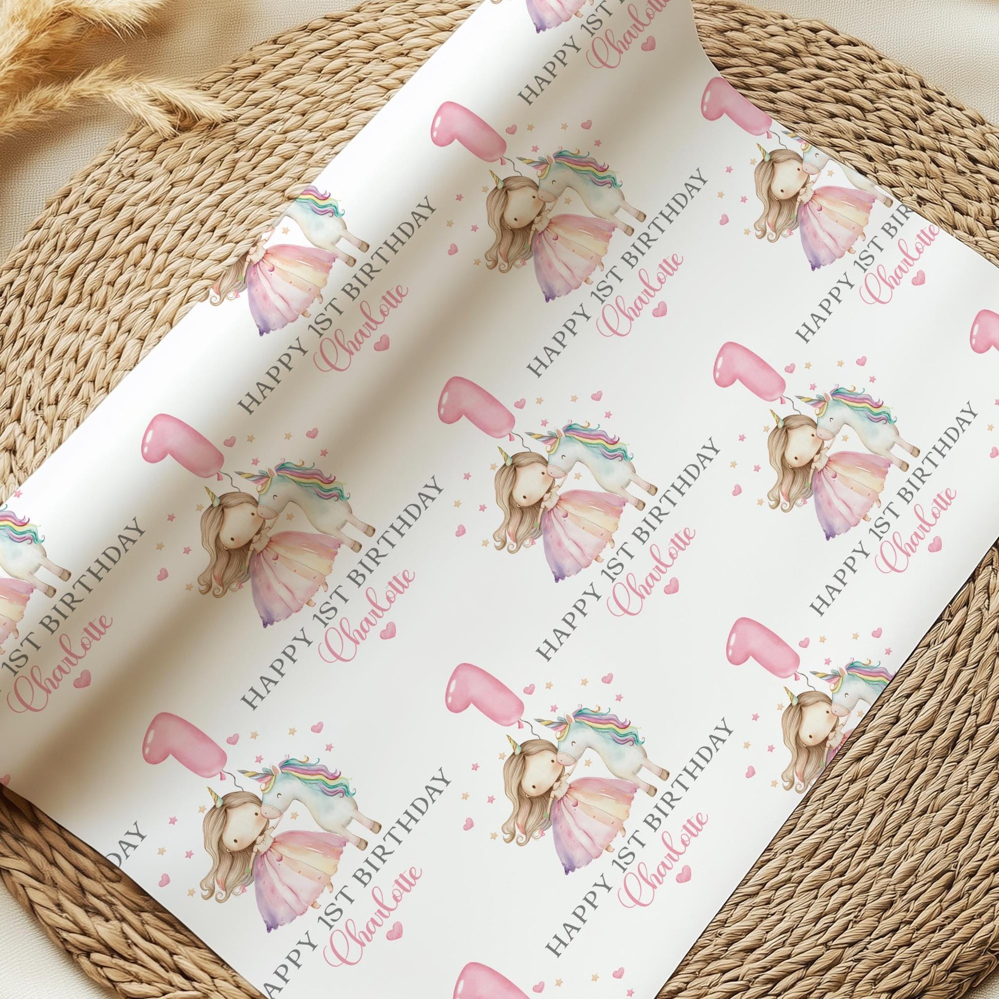 White luxury 1st birthday personalised wrapping paper featuring a gorgeous pastel coloured unicorn & a princess with a number 1 pink balloon and the wording, Happy 1st Birthday personalised with childs name.