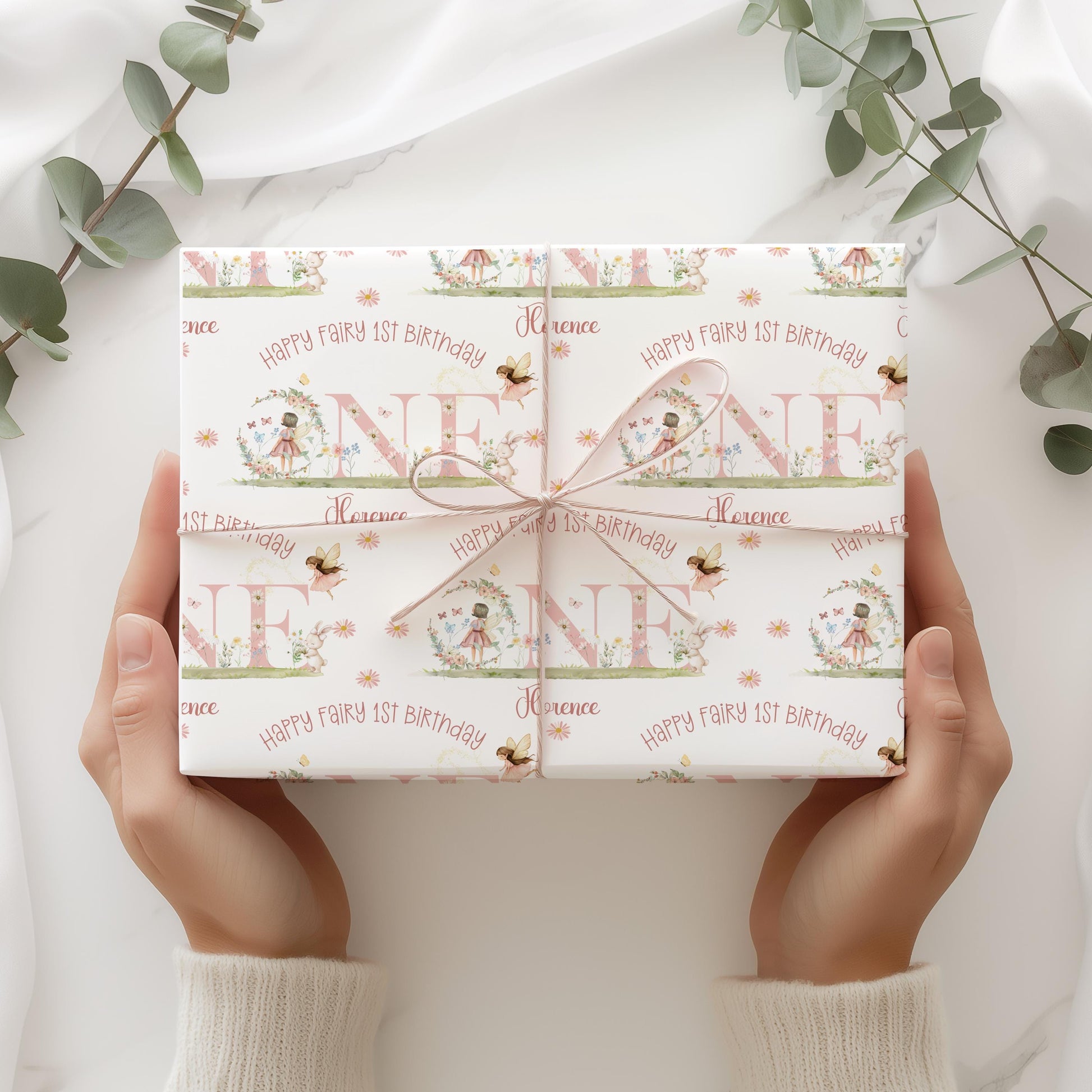 Gift wrapped with personalised pink fairy 1st birthday wrapping paper