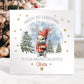 Personalised baby’s 1st Christmas card for Boys & girls featuring a cute bunny in a red hat holding a present, snowy woodland background with fir trees and gold stars. Printed on premium 300gsm card.