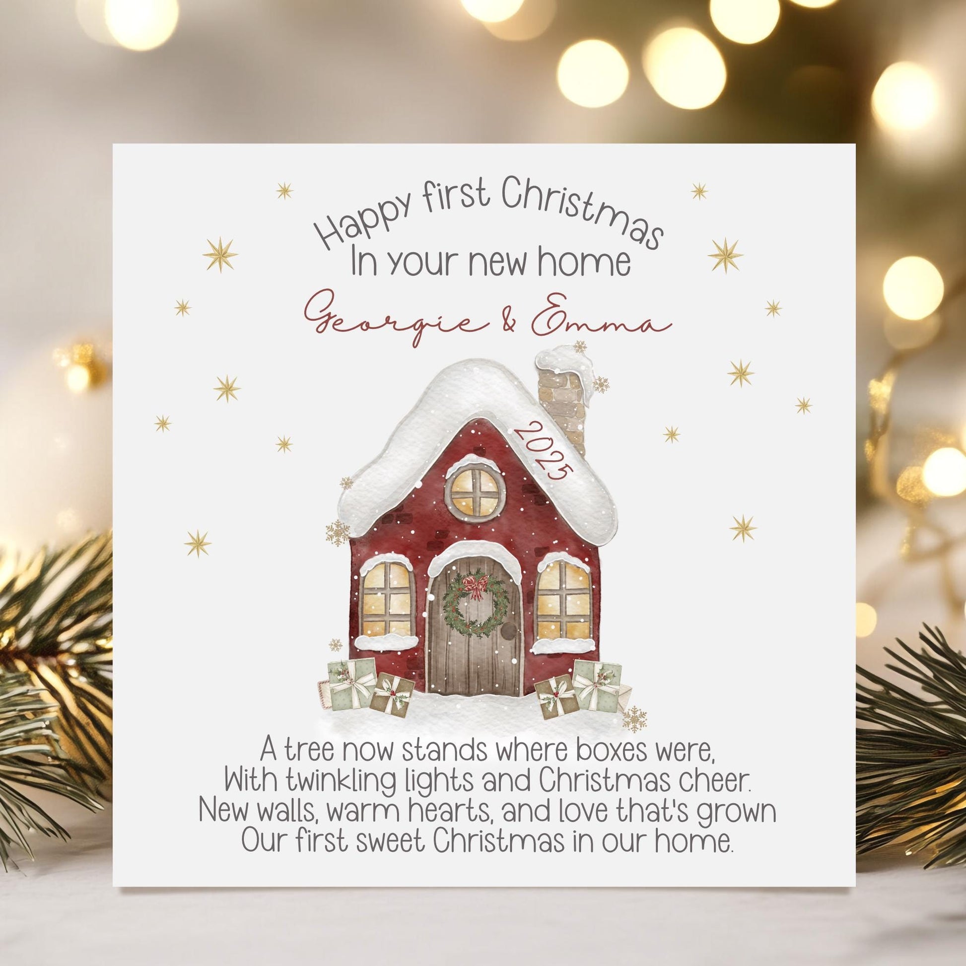 Personalised Christmas card featuring a cosy red snow-covered house with a wreath on the door and wrapped gifts outside. Surrounded by golden stars, the card reads “Happy First Christmas in Your New Home” and includes a short festive poem. The design can be customised with names and the year.