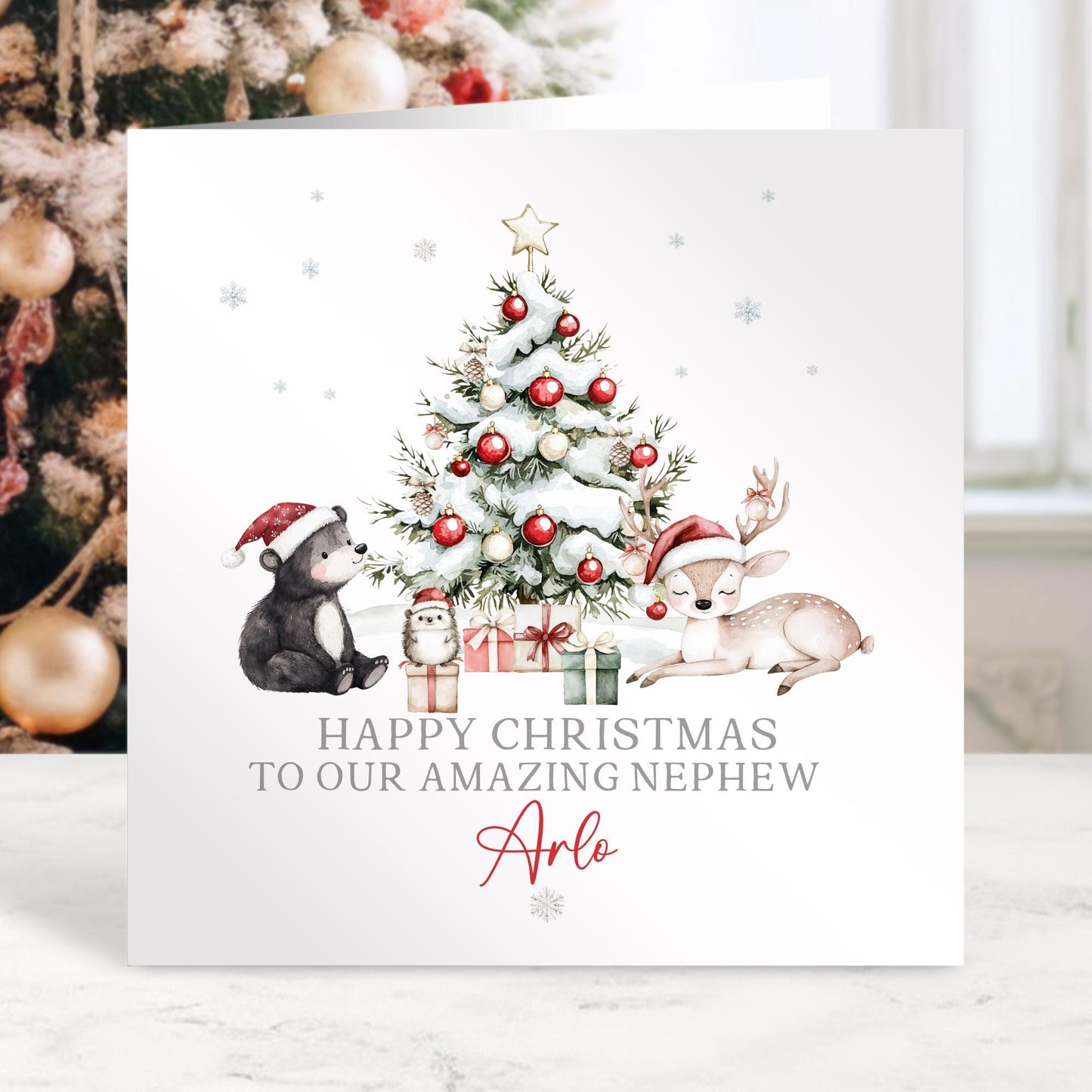 Christmas card with festive illustration of a tree, presents, and animals with personalized text.