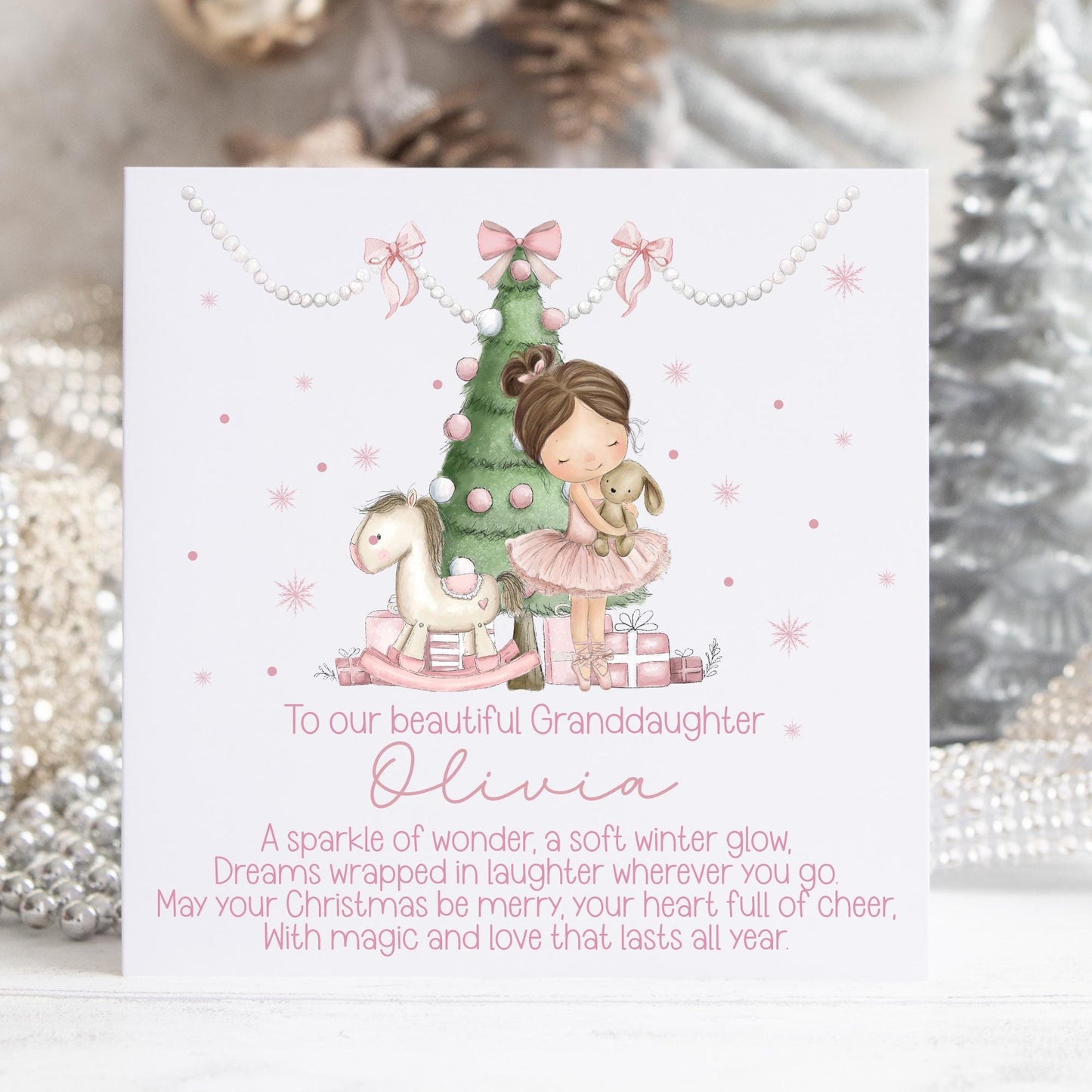 Personalised Christmas card featuring a sweet little girl in a pink ballerina dress hugging a soft toy beside a decorated Christmas tree and pink presents. Includes the text “To our beautiful daughter” with space for a personalised name and a festive Christmas poem beneath. Soft pastel colours, winter sparkle details, and a magical holiday theme ideal for daughters.